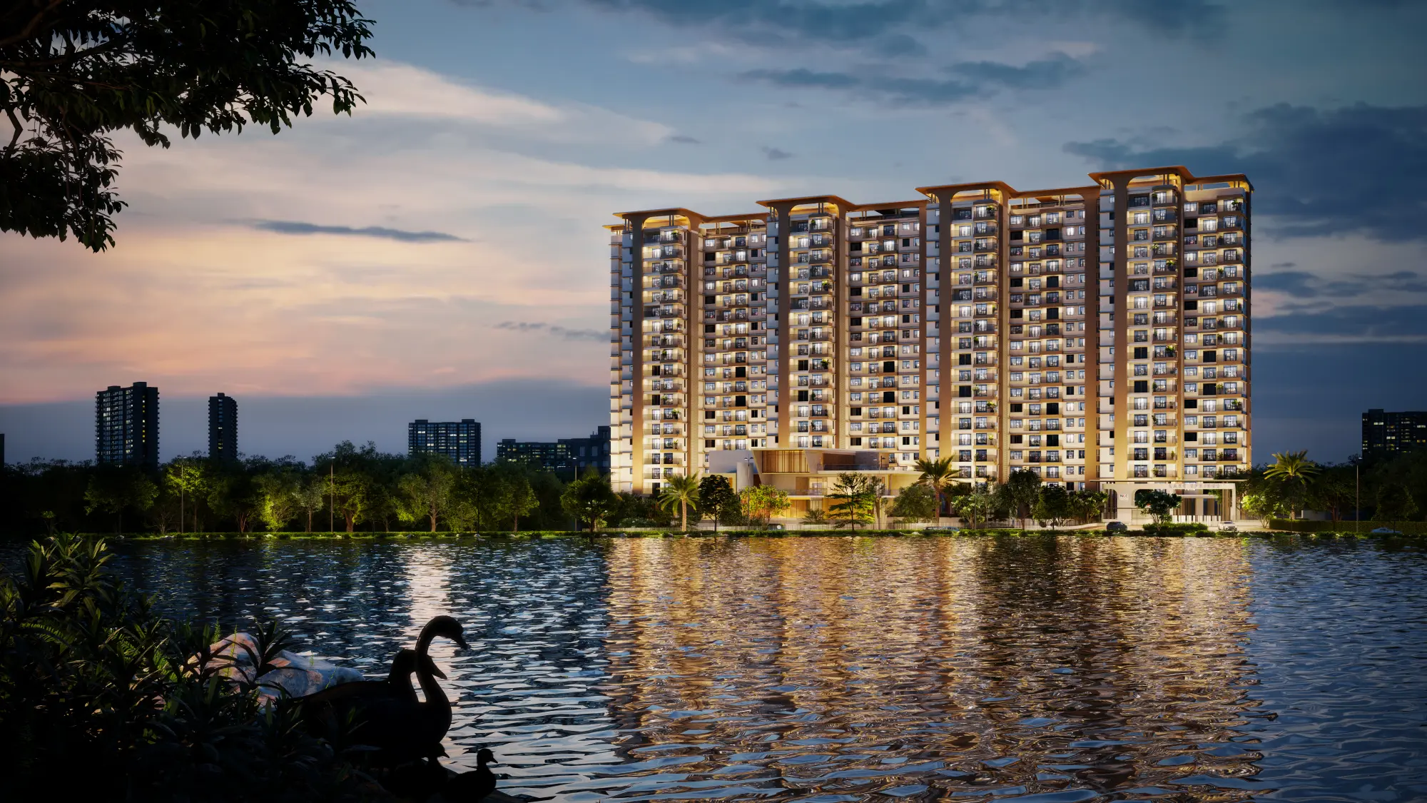 Lake Springs towers illuminated at night reflected in Avalahalli Lake
